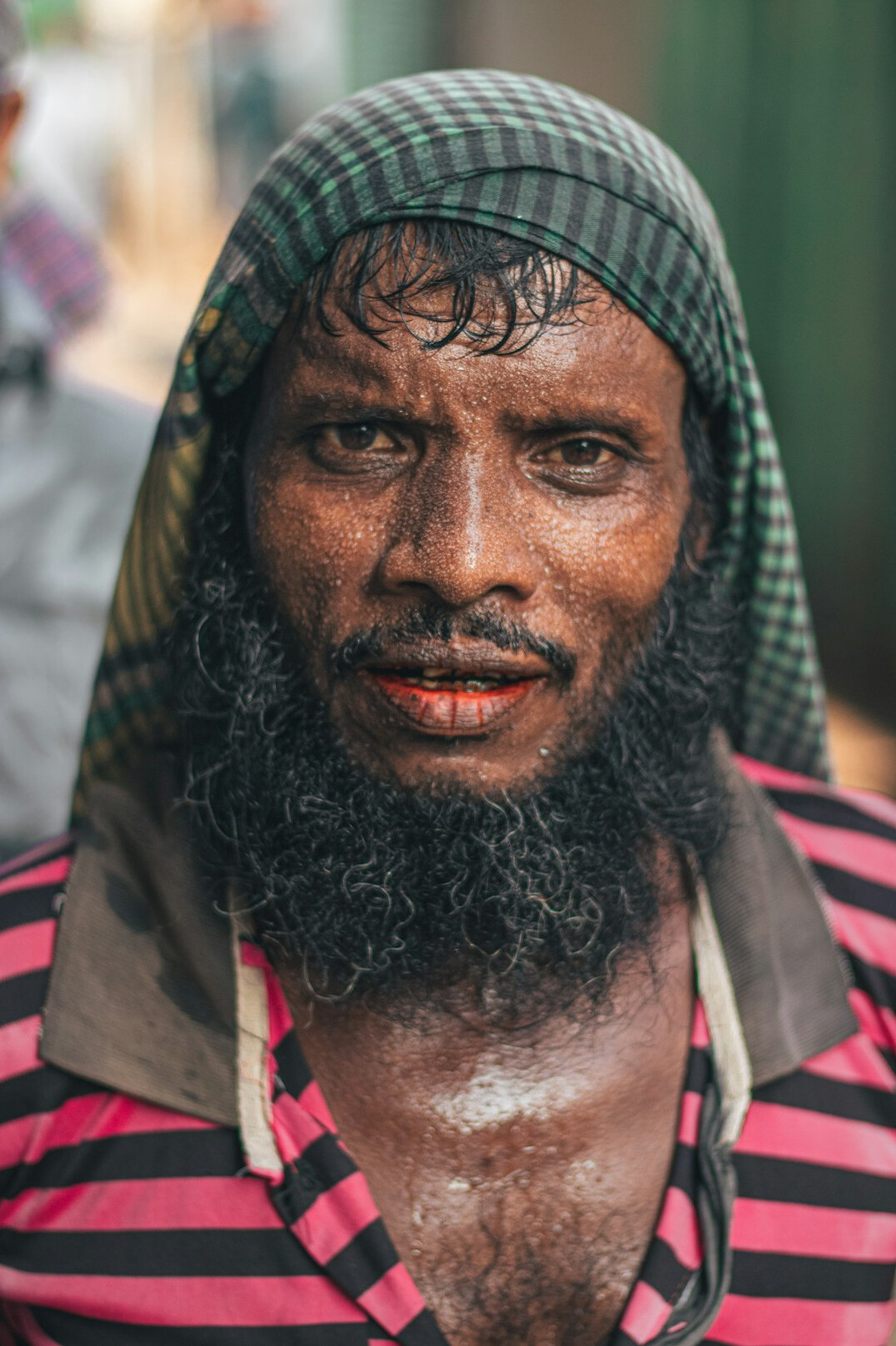 Portrait of a young Indian-Malaysian man with short hair, smart casual outfit
