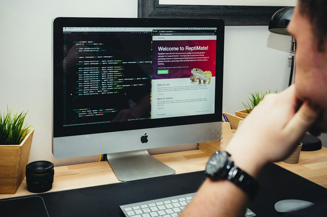 young programmer coding at desk