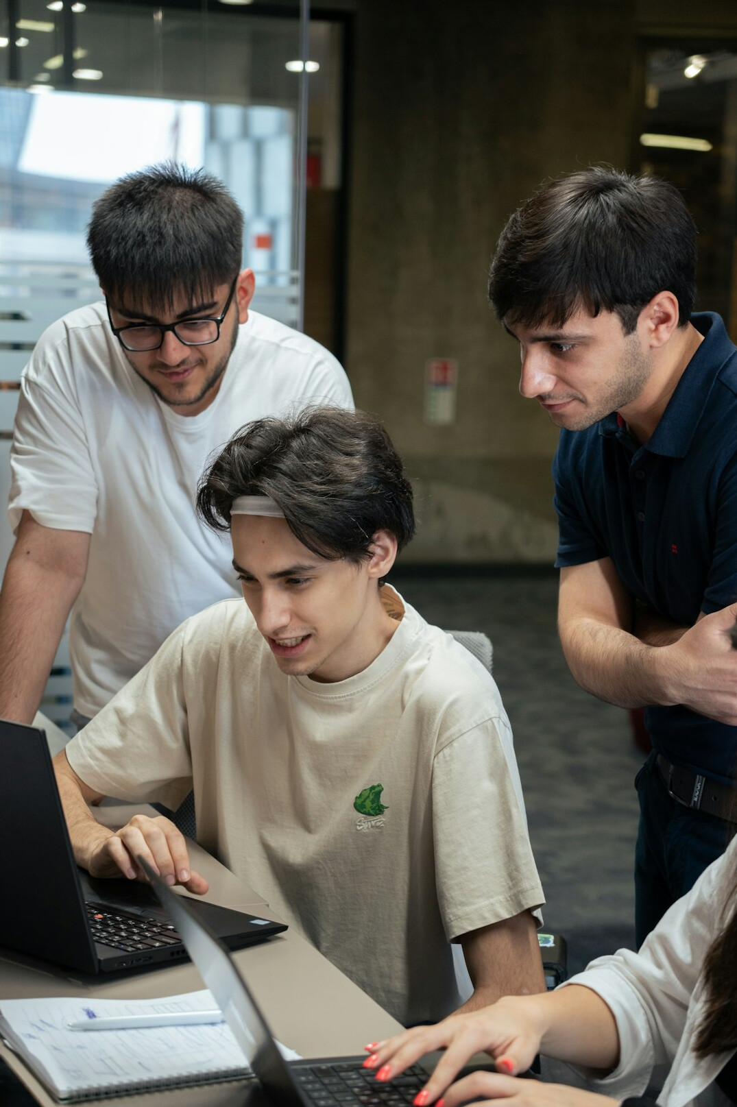 diverse students coding together