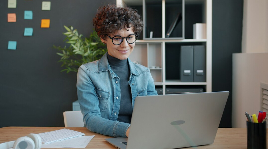 woman coding at desk