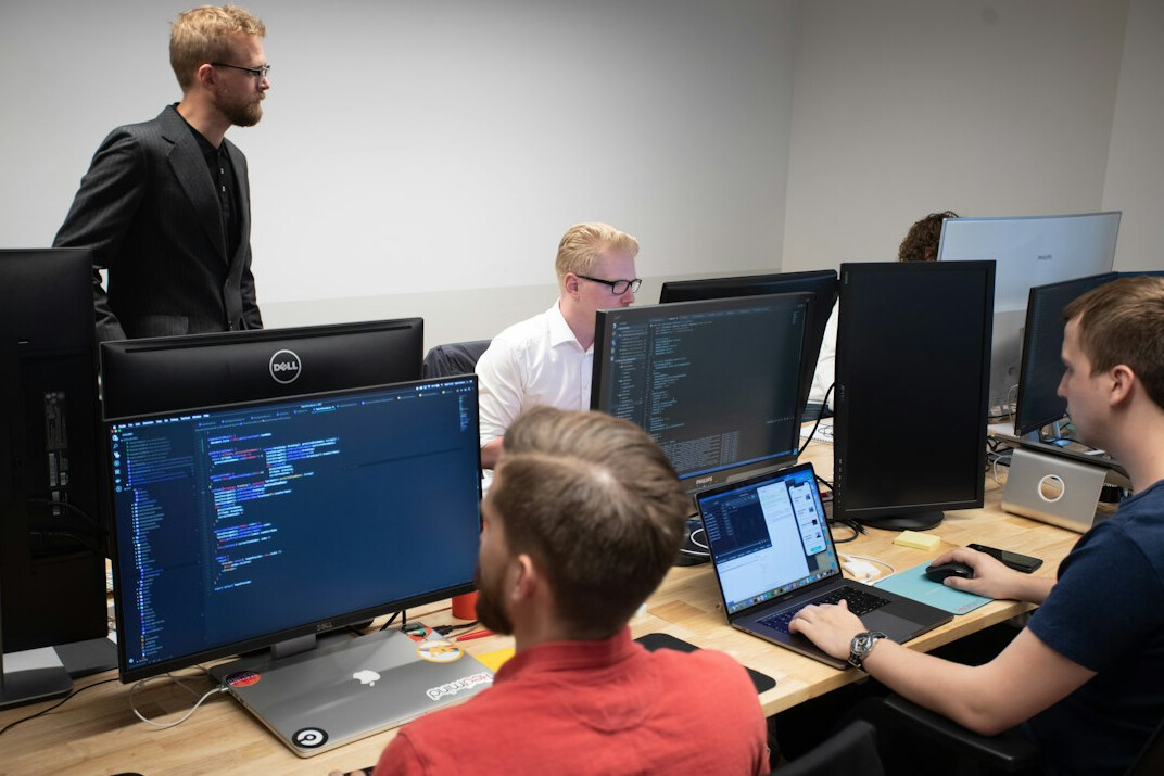 group of students discussing code