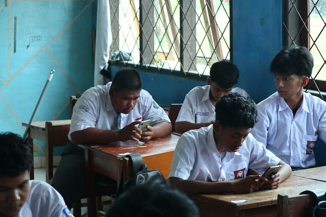 students learning coding in classroom