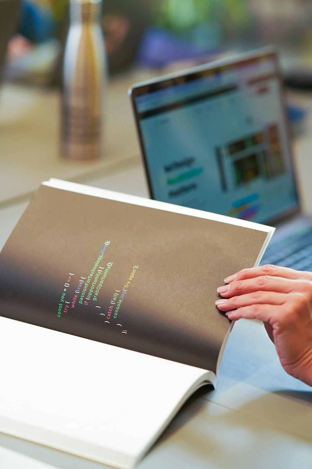 programmer coding on laptop in office