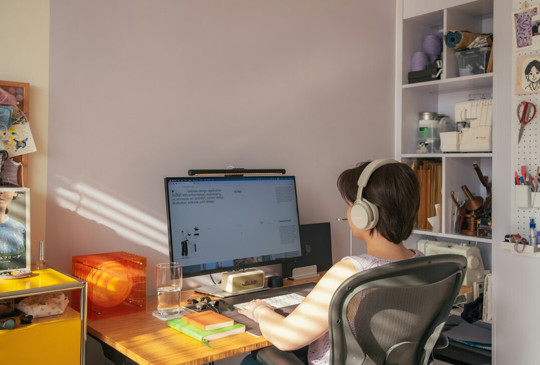 woman coding at home desk